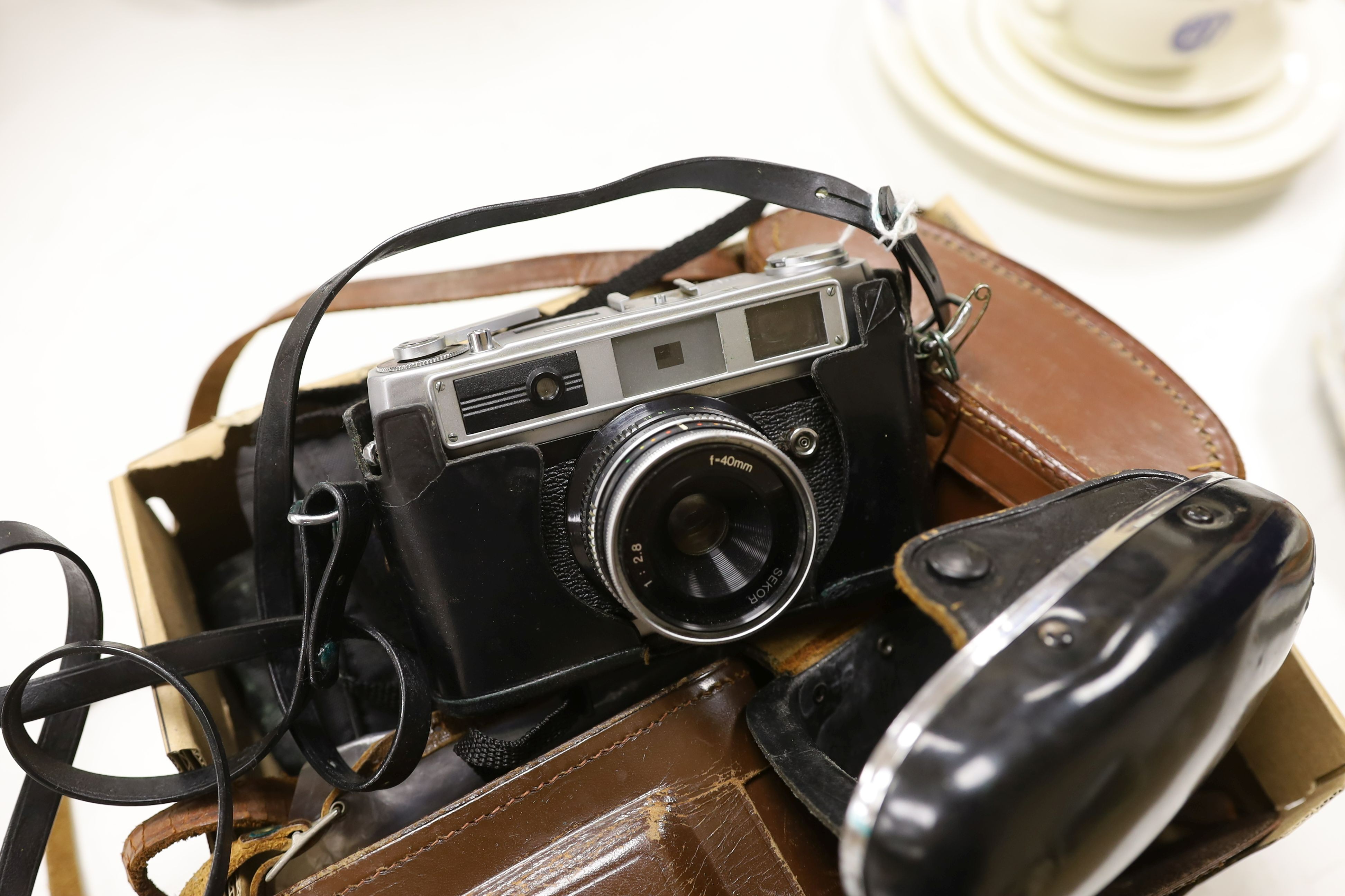 A pair of Taiga binoculars, various cameras etc.